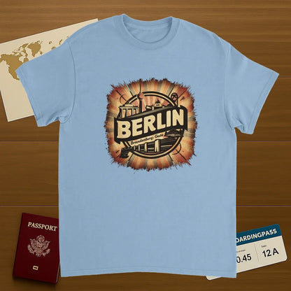 light blue Berlin Germany Unisex Travel T-Shirt on wooden background with world map, passport, and boarding pass